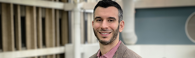 Headshot of NJM employee Aaron in headquarters atrium.