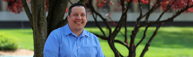 Outdoor headshot of NJM employee, Jose.