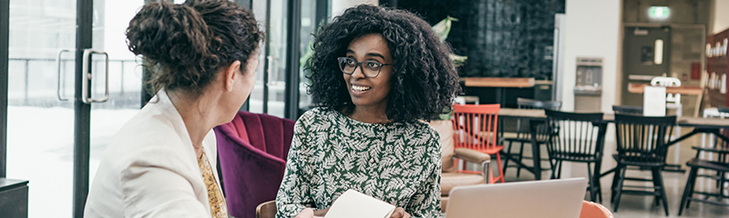 Two businesswomen having a discussion/interview.