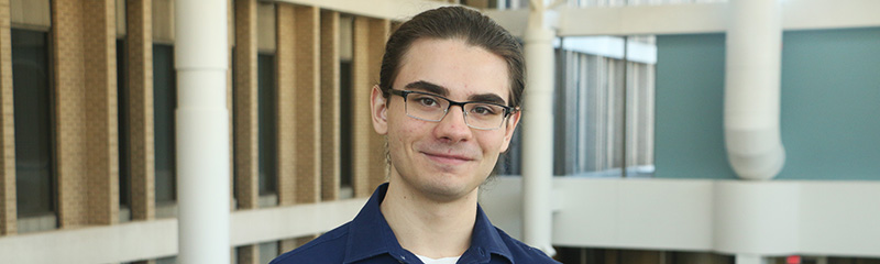 Headshot of NJM intern, Joe, in headquarters atrium.