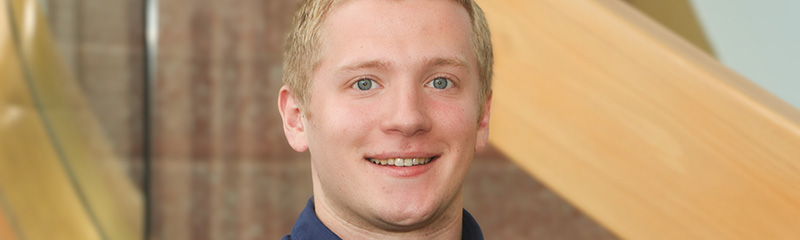 Headshot of NJM intern John.